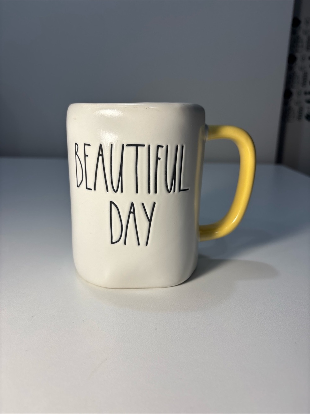 Rae Dunn White Ceramic Mug with Yellow Handle - BEAUTIFUL DAY